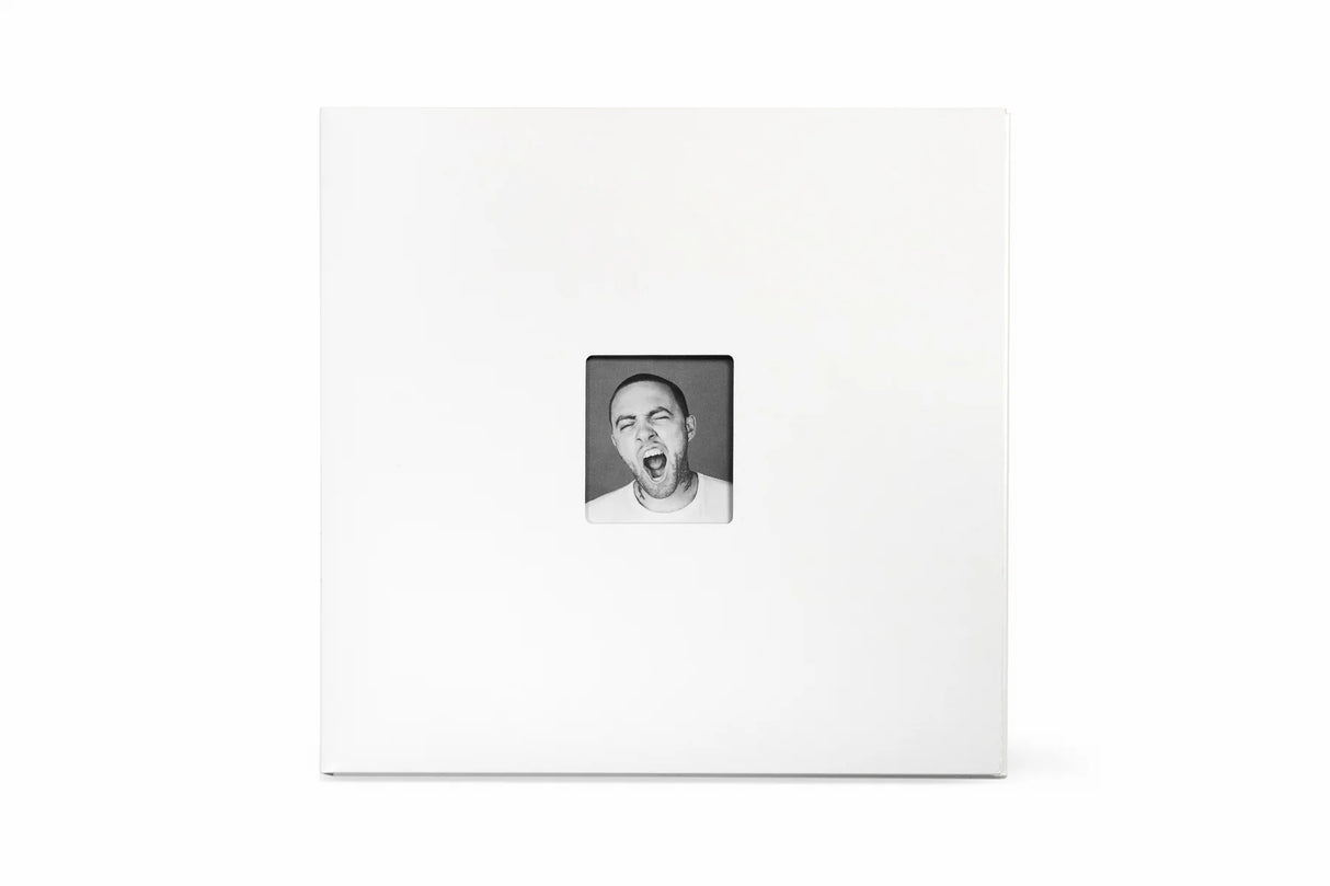 White photo album with a black and white photo of a person on a white background