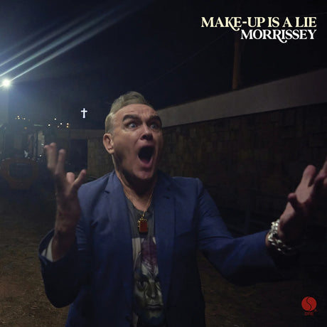 Person in a blue suit with arms outstretched, text 'Make-Up Is A Lie Morrissey' above.