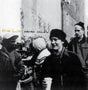 Album cover with black and white photo of people and text 'Elliot Smith Roman Candle'.