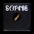 Black vinyl record sleeve with 'SOPHIE' branding and a circular label featuring wavy lines.