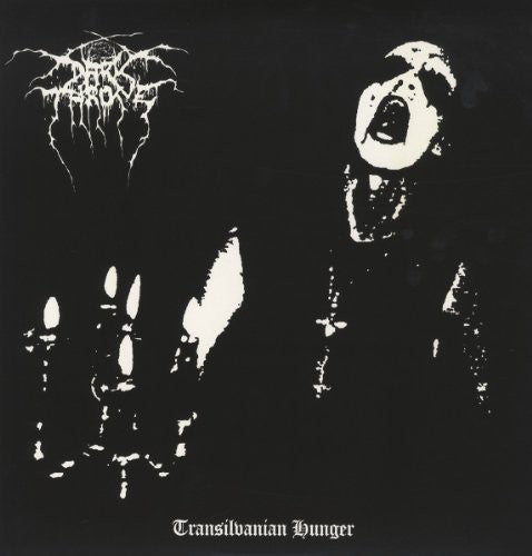 Album cover with a skeleton hand, mouth, and text on a black background