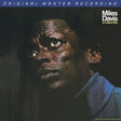 Album cover featuring a close-up of a person with text about Miles Davis' 'In A Silent Way'.