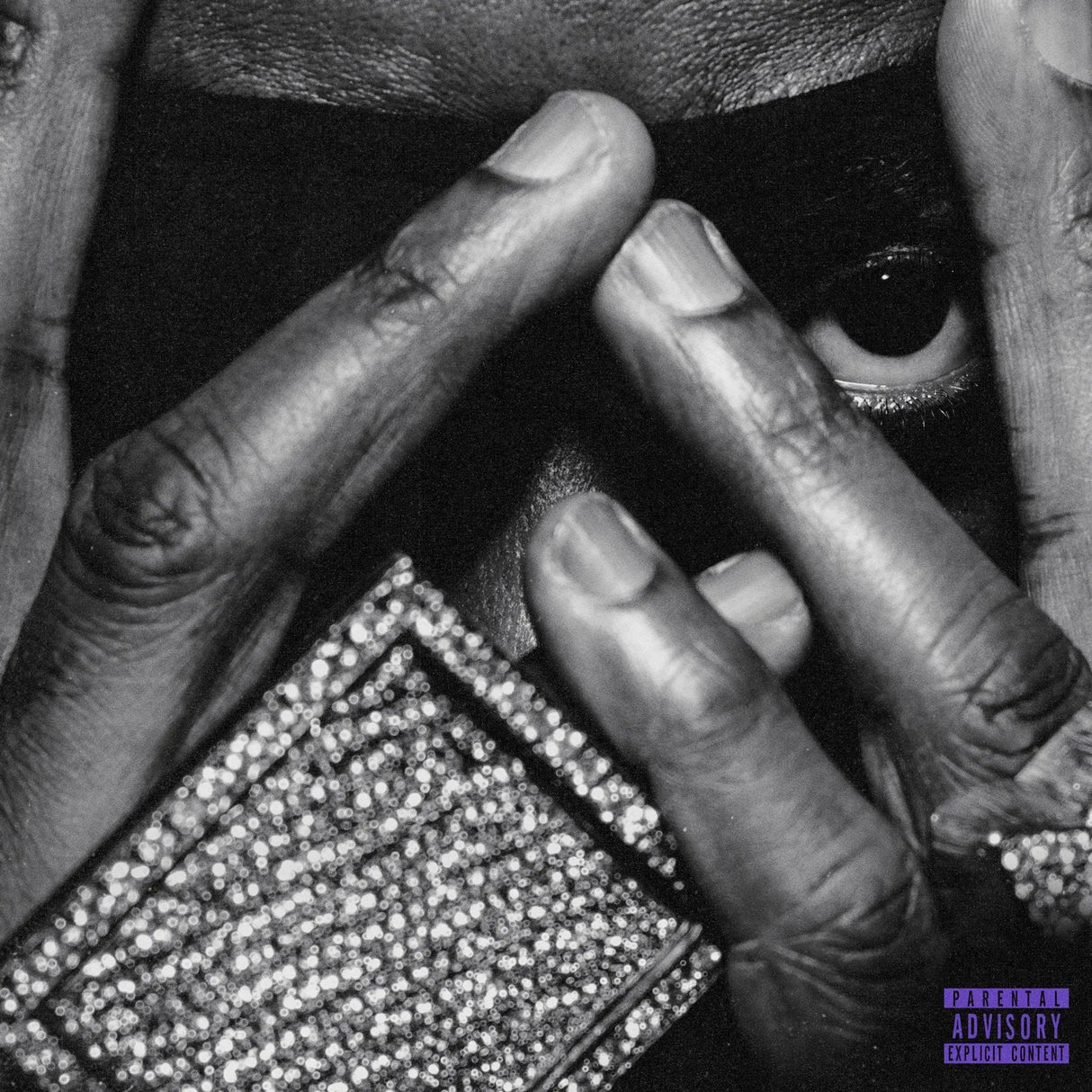 Close-up of hands holding a product with a 'Mature Content' label.