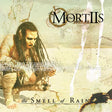 Album cover for 'Mortiis' featuring a person with long hair and text about 'The Smell of Rain'.