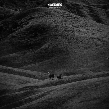 Two animals on a hillside with a dark, textured background