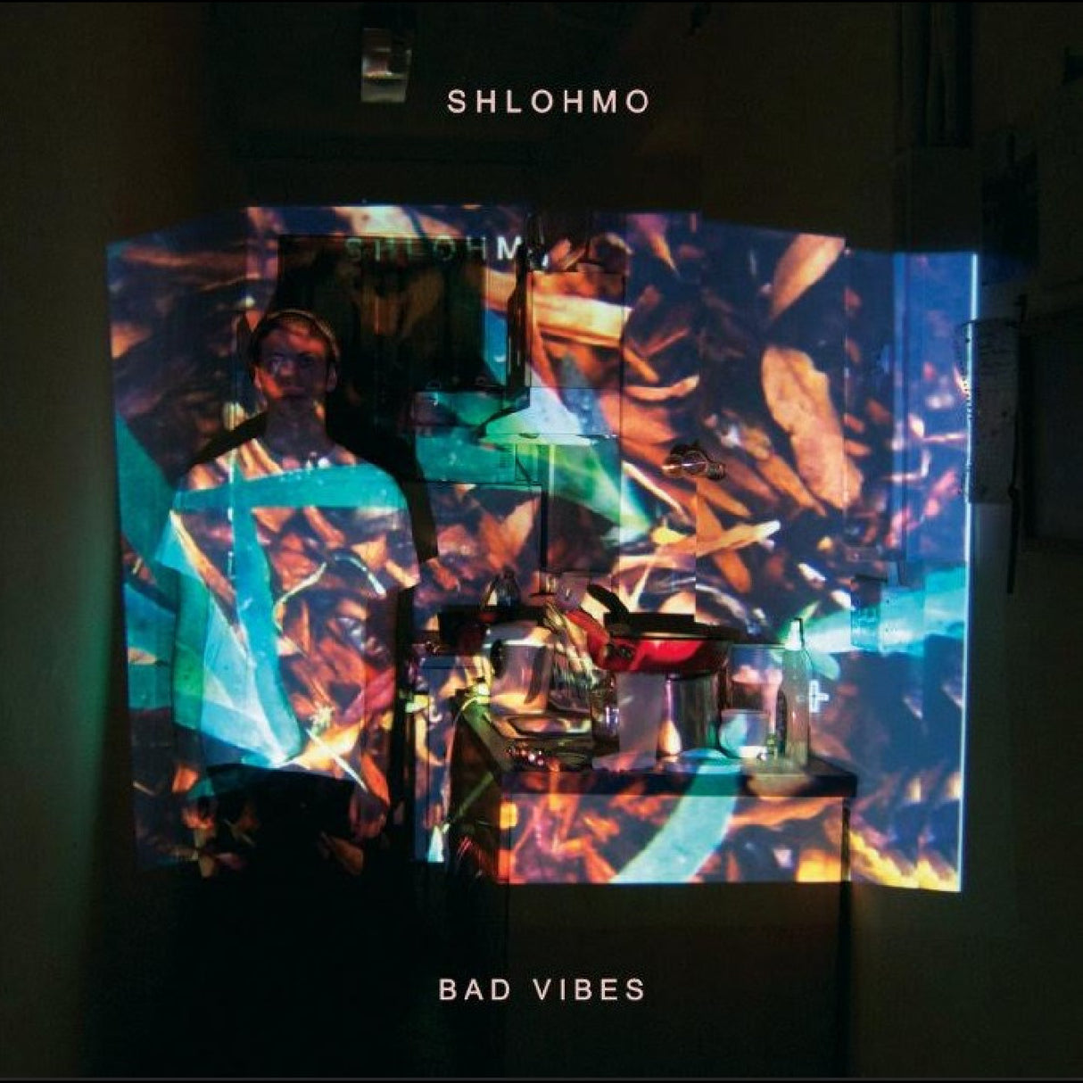 Album cover with 'SHLOHMO' and 'Bad Vibes' text, featuring a colorful abstract design.