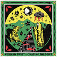 Album cover for 'Chasing Shadows' by Nubiyan Twist with abstract design elements.