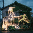 Horses made of wire and plants on a building facade
