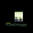 Album cover with two people in a field and text 'DJ Kicks: Kruder & Dorfmeister The Complete Mix Edition' on a black background.