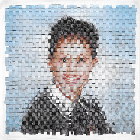Mosaic portrait of a person made from small tiles on a white background