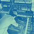 A stylized blue halftone graphic showing a musician working at multiple keyboards and audio equipment, with the text 'IN ELECTRIC TIME' across the top.