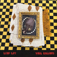 Album cover with a framed hand and decorative elements on a checkered background