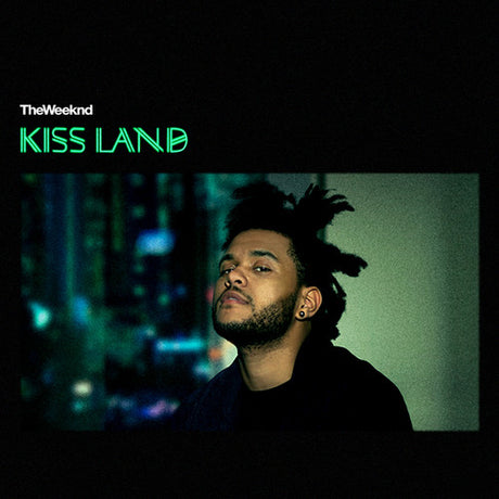 Album cover for 'Kiss Land' by The Weeknd with a person looking away against a blurred cityscape.