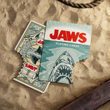 Jaws-themed playing cards on a sandy surface