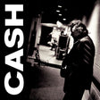 Black and white album cover with a person leaning against a wall, text 'CASH' on the left.