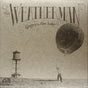 Album cover for 'The Weatherman' by Gregory Alan Isakov featuring a water tower and balloon.