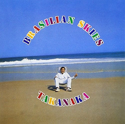 Person sitting on a beach with 'Brasillian Skies Takanaka' text overlay