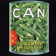 Can of okra with a tomato on a black background