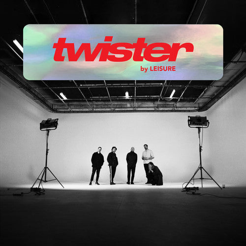 Stage setup with 'twister by LEISURE' sign above, five people on stage, and lighting equipment.
