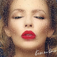Album cover with a woman's face through raindrops, featuring red lipstick.