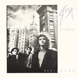 Album cover with a black and white photo of people in front of buildings, featuring the text 'Soda Stereo Doble Vida'.