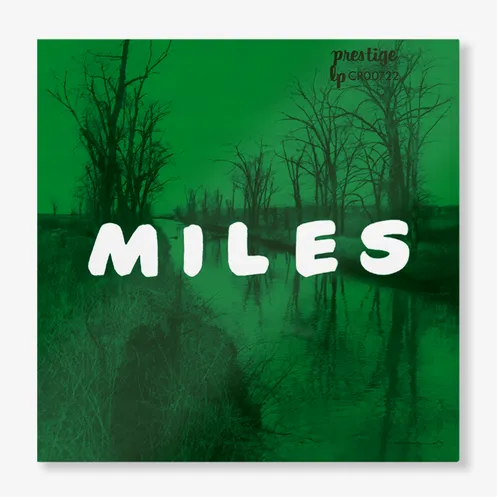 A vinyl record cover featuring the title 'Miles' in large white text on a green background, with a silhouette of a tree in the foreground and a calm night sky in the background.