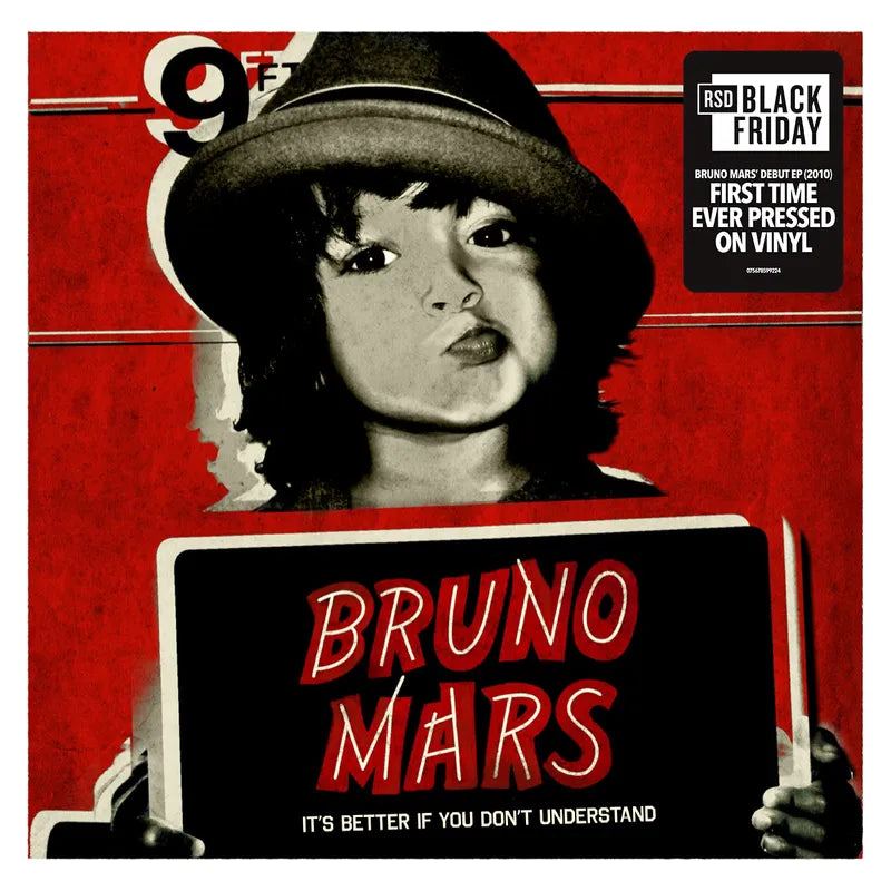 Vinyl record cover with a person holding a sign displaying 'Bruno Mars' on a red background.
