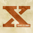 Large brown letter 'X' with 'Adobe Sessions' text on a textured beige background