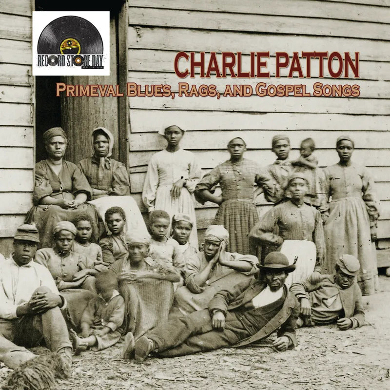 Album cover featuring a group of people in front of a wooden building, with 'Charlie Patton' and 'Primeval Blues, Rags, and Gospel Songs' text.
