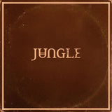 A square brown album cover or box with the word "JUNGLE" centered in a stylized beige serif font, surrounded by a thin beige border and showing a distressed, vintage texture.