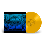 A vinyl record package shown on a black background, featuring a bright yellow-gold LP disc partially pulled from a sleeve. The sleeve artwork is a blue-toned photograph of people reclining outdoors with palm trees and buildings.
