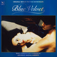 Album cover for the 'Blue Velvet' original motion picture soundtrack, featuring a blue background with the title in white script and a central film still of a woman and man embracing.
