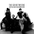 Black and white album cover for 'Liberty Belle and the Black Diamond Express' by The Go-Betweens, featuring four band members posing on a dark leather couch against a white wall.