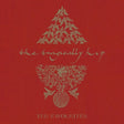 The album cover of 'The Tragically Hip - Yer Favourites Volume 1' featuring a red background with a white silhouette of a tree and the band's name.