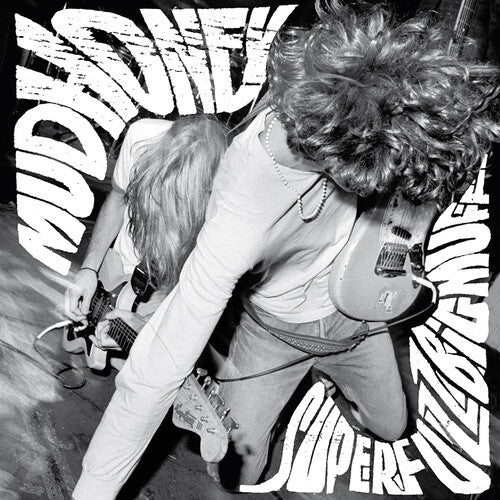 Black and white album cover featuring a member of Mudhoney with a prominent afro hairstyle, playing a guitar. The album title 'Superfuzz Bigmuff' is visible.