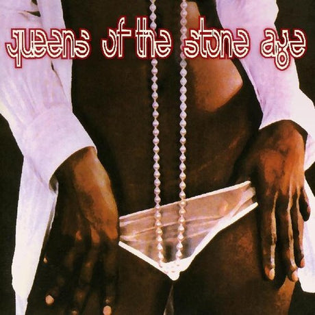 Album cover with 'queens of the stone age' text and a person holding a necklace.