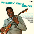 A cover image of the Freddy King album 'Sings LP' featuring a photo of Freddy King with a guitar, smiling and singing.