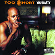 Album cover of Too $hort - You Nasty, featuring a man with a chain around his neck, sitting on a couch with a cigarette in his mouth.