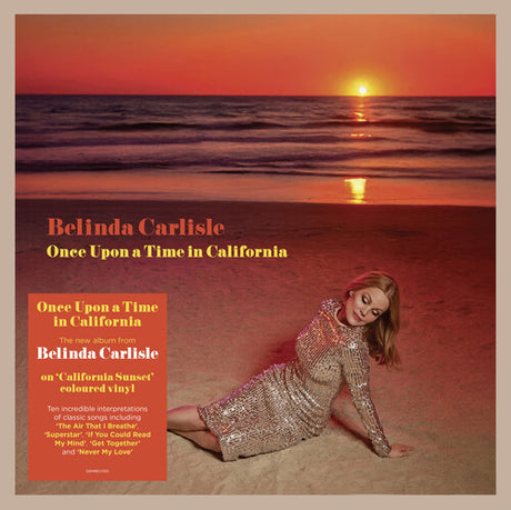 Album cover with a sunset over the ocean and a person in a silver dress, featuring text about Belinda Carlisle's 'Once Upon a Time in California' album.