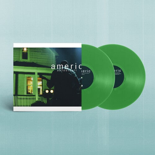 Green vinyl records with a cover featuring a silhouette of a person in front of a house.