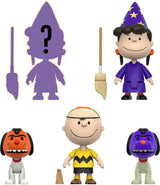 Set of Peanuts character figurines including a wizard, a dog with a question mark, and others on a white background.