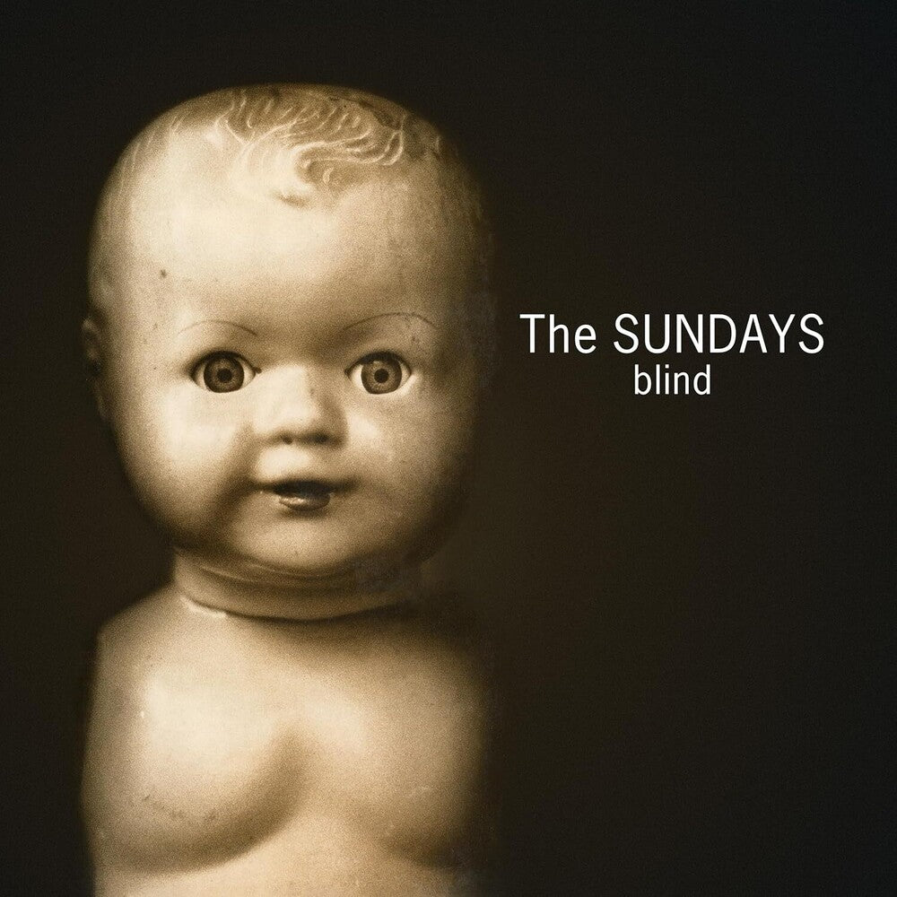 Album cover with a vintage doll face and text 'The SUNDAYS blind' on a dark background