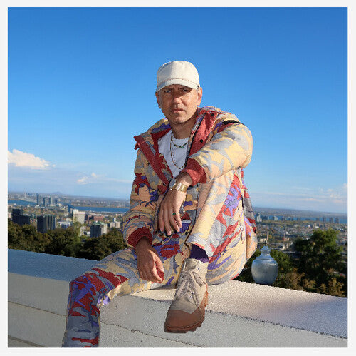 Person wearing a colorful outfit with a cityscape in the background