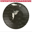 Vinyl record with a person's reflection and 'Station to Station David Bowie' text.