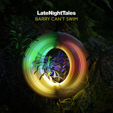 Album cover for 'LateNightTales' featuring a coiled cable with multicolor lighting on a dark background.