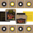 Vinyl record set with colorful labels and a box featuring a band's image on a beige background.
