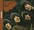 Rubber Soul 2 CD Edition album cover featuring the band members in a dark green forest setting with the band's name in large orange lettering at the top.