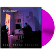 A vinyl record album cover for 'Kill Them Suicide' by the band 'brutal truth'. The square album cover features a dark, moody photograph of a man in a room with a window and a TV, with a bright pink translucent vinyl record partially visible behind it on a white background.
