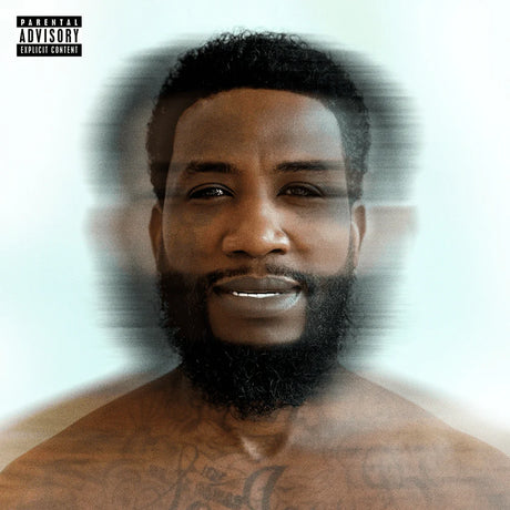 Man with a beard and tattoos on a white background with 'Parental Advisory' label.
