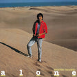 Album cover with a person standing on sand dunes, text 'alone' and 'Masayoshi Takanaka'.